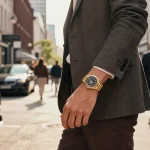 Individual flaunting a Rolex replica watch in a vibrant urban setting, exuding luxury and style.