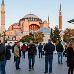 A vibrant scene of travelers exploring Istanbul's iconic landmarks, showcasing istanbulpano.com.